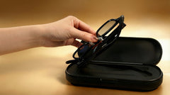 SGG VAULT Charge hero image showing Rokid Glasses being placed into the open charging case — SmartGlass Gear