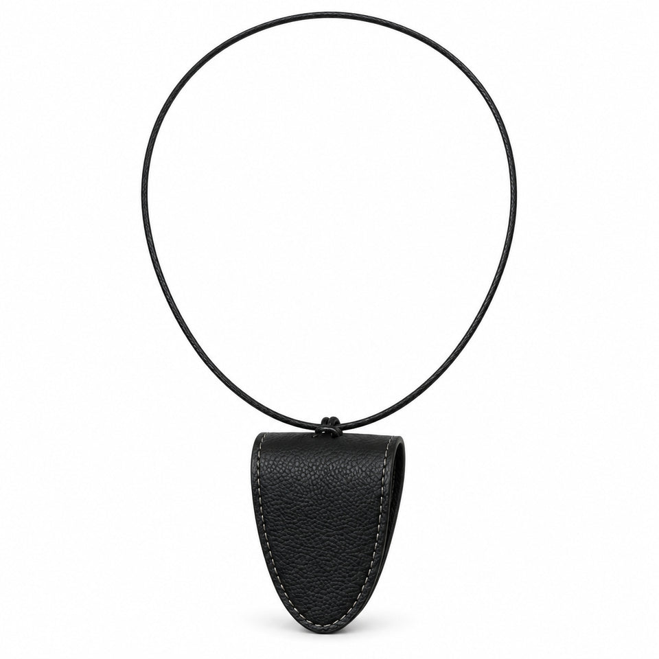 Black magnetic leather glasses-holder necklace and black cord; glasses not included.